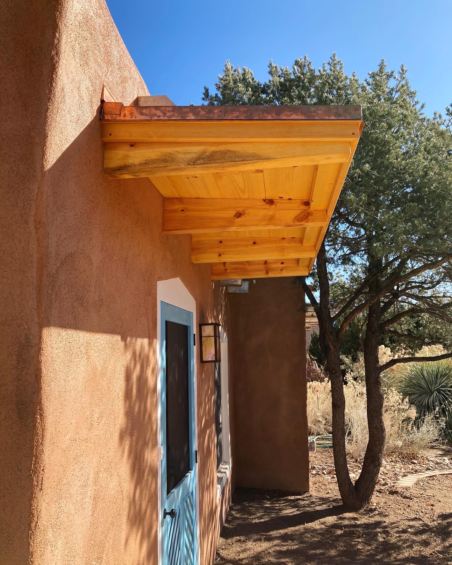 Adobe House Remodel Copper Roofed Overhang